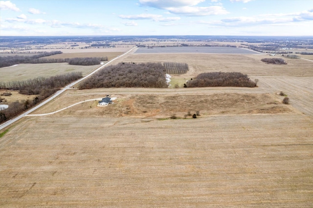 birds eye view of property featuring a rural view