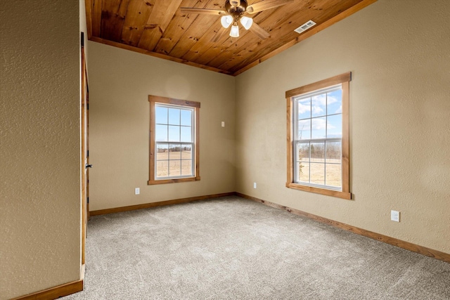 spare room featuring lofted ceiling, ornamental molding, ceiling fan, wood ceiling, and light carpet