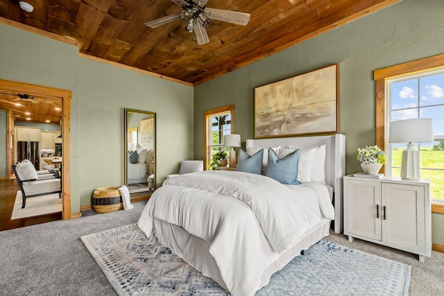 10263 State Highway 14 W, Billings, MO 65610 - bedroom with multiple windows, wooden ceiling, carpet flooring, a textured wall, and baseboards