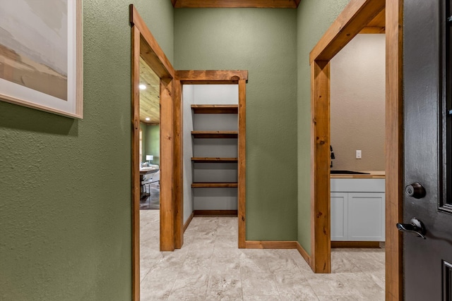 10263 State Highway 14 W, Billings, MO 65610 - hall featuring a textured wall and a sink