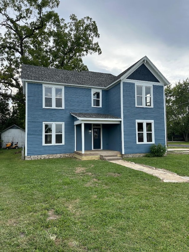 view of front of home featuring a front yard