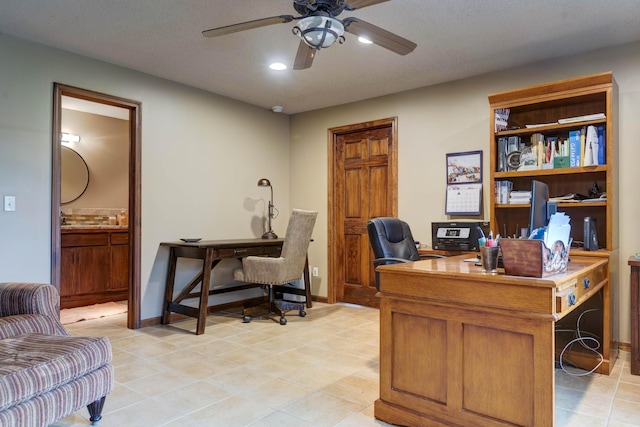 office space featuring ceiling fan