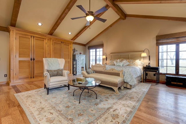 bedroom featuring ceiling fan, beam ceiling, high vaulted ceiling, and light hardwood / wood-style flooring