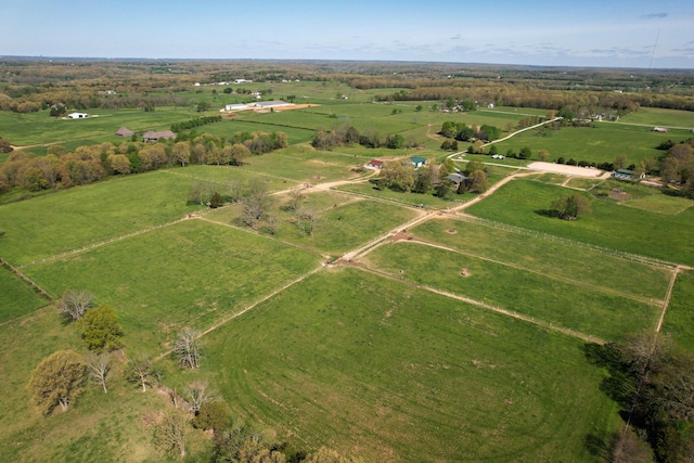 birds eye view of property with a rural view