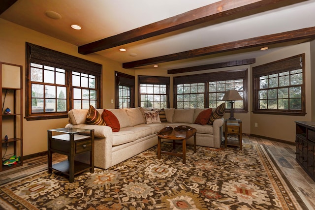 living room with beamed ceiling and wood-type flooring