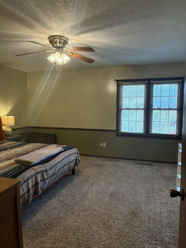 unfurnished bedroom with ceiling fan and carpet