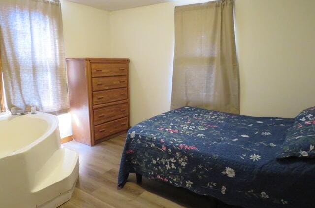 bedroom featuring hardwood / wood-style flooring