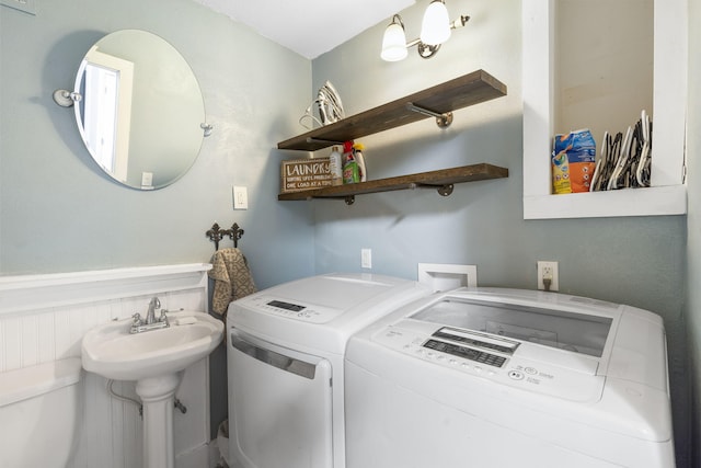 laundry room featuring washing machine and dryer and sink