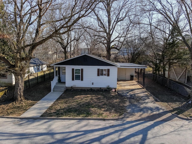 view of front of home featuring fence