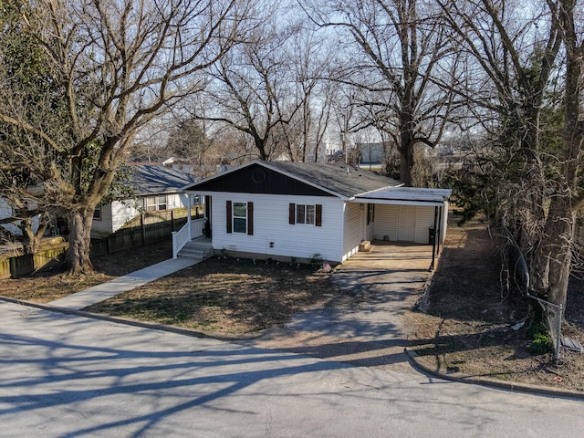 view of front of home featuring fence