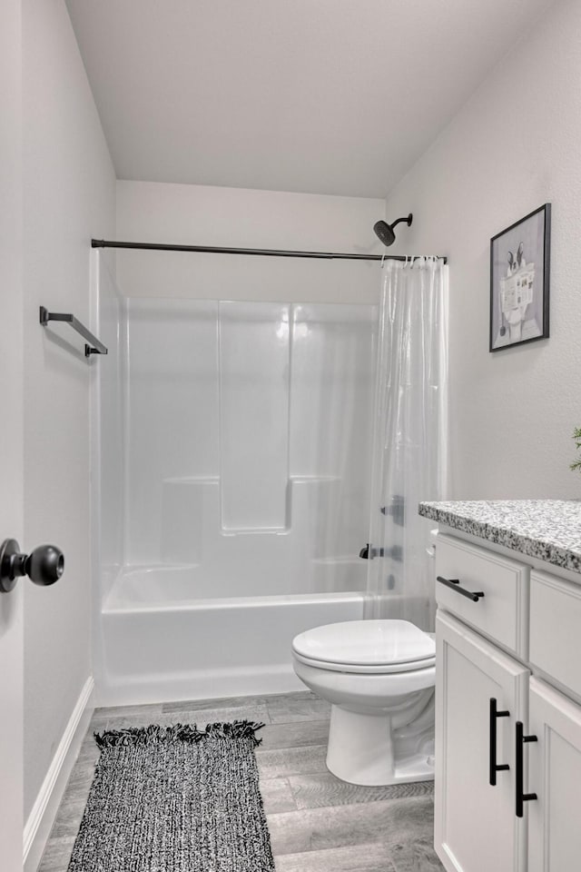 full bathroom featuring shower / bathtub combination with curtain, vanity, toilet, and wood-type flooring