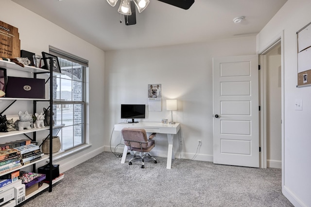 home office with ceiling fan and carpet