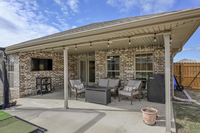 view of patio / terrace with an outdoor living space and a grill