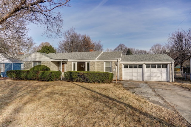 ranch-style home featuring a garage and a front yard