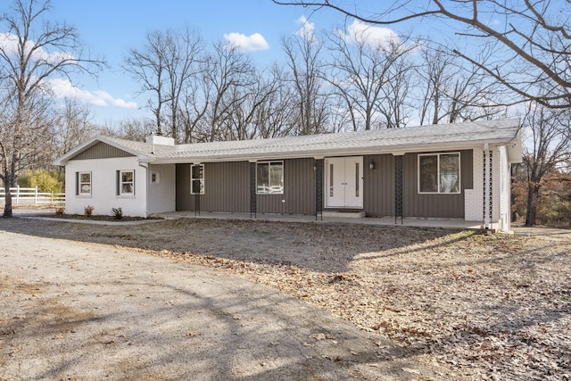 ranch-style house featuring a porch