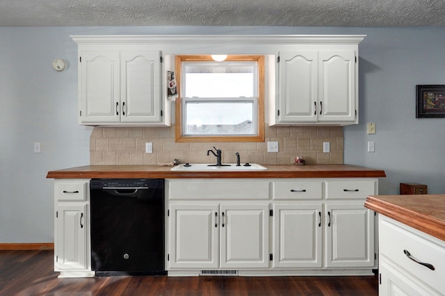 kitchen featuring white cabinetry, dishwasher, sink, and butcher block counters