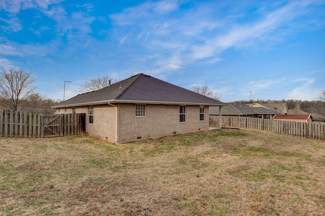 back of property featuring a yard