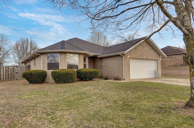 single story home featuring a garage and a front lawn