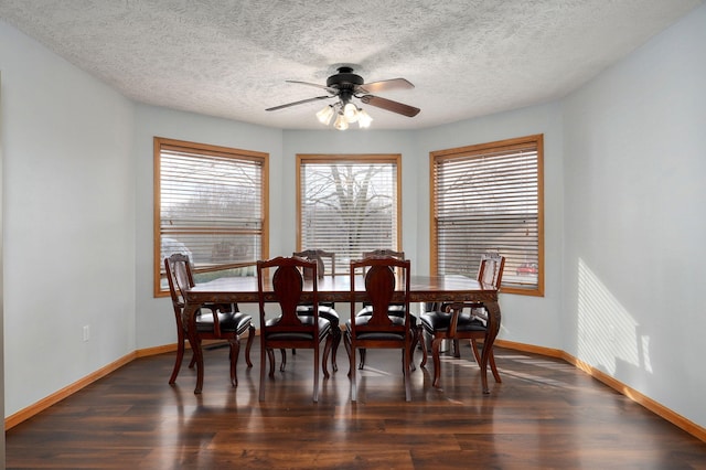 dining room featuring ceiling fan, dark hardwood / wood-style flooring, and a textured ceiling