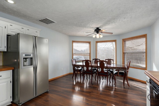 dining room with dark hardwood / wood-style flooring and ceiling fan