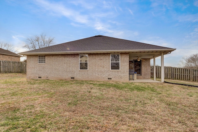 back of house featuring a yard, a patio area, and ceiling fan