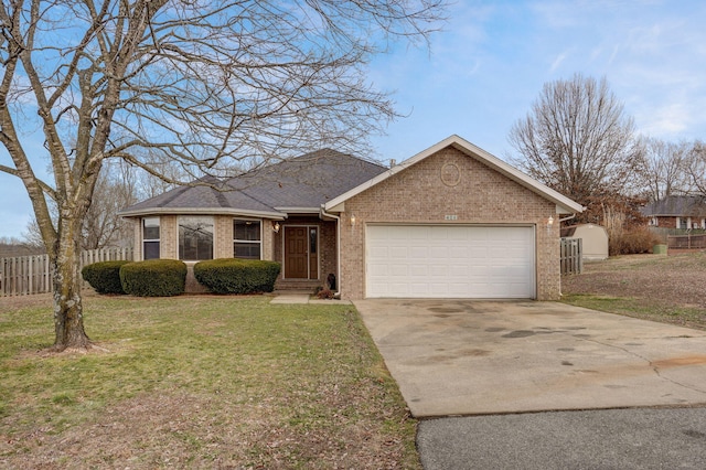 ranch-style house featuring a garage and a front lawn