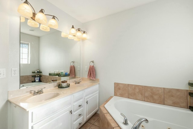 bathroom featuring tile patterned flooring, vanity, and tiled bath