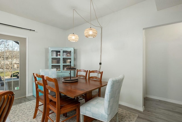 dining area with wood-type flooring