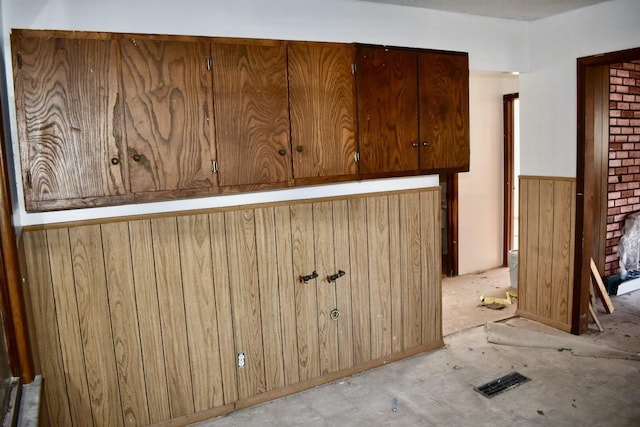 interior space featuring wooden walls