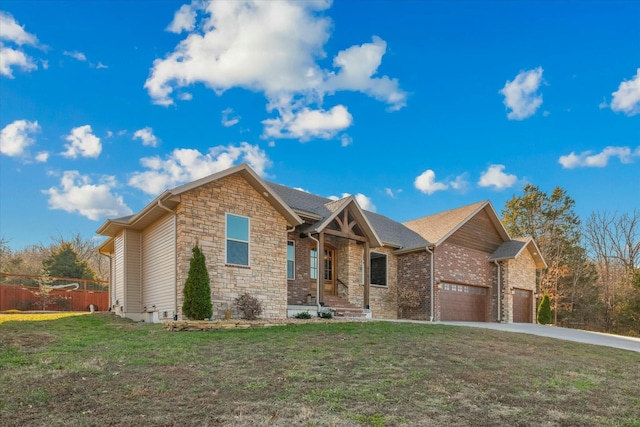 view of front of property with a garage and a front yard