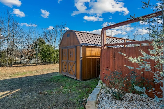 view of outdoor structure featuring a lawn