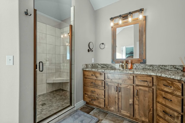 bathroom featuring walk in shower and vanity