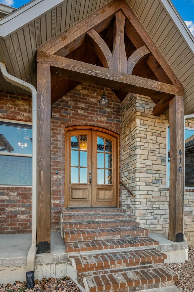 view of exterior entry featuring french doors