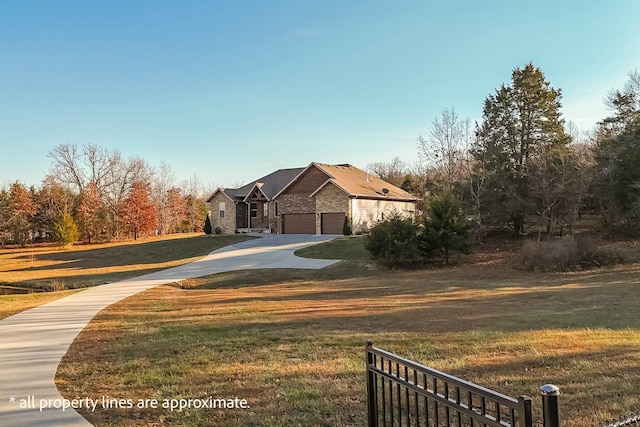 exterior space with a garage and a lawn