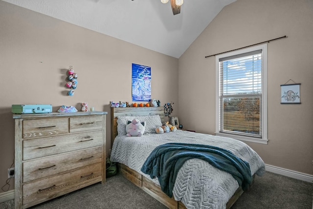 bedroom with dark colored carpet, vaulted ceiling, and ceiling fan