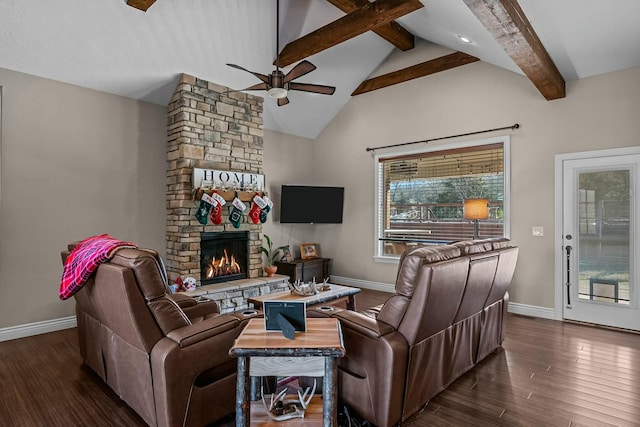 living room with dark wood-type flooring, ceiling fan, a fireplace, and lofted ceiling with beams