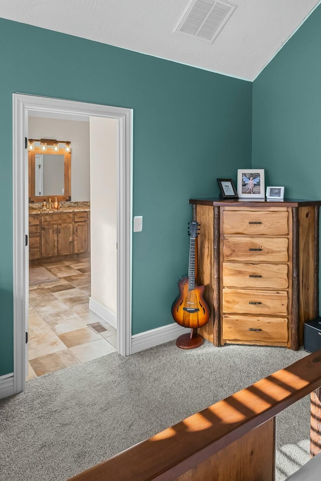 bedroom featuring light carpet