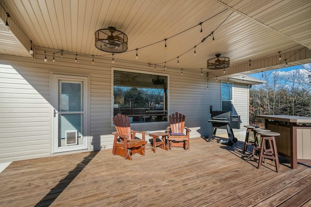 wooden deck featuring an outdoor bar