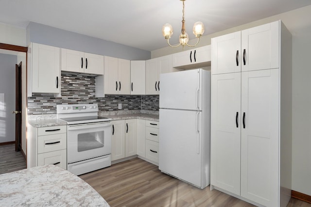 kitchen with white appliances, decorative light fixtures, decorative backsplash, and white cabinets