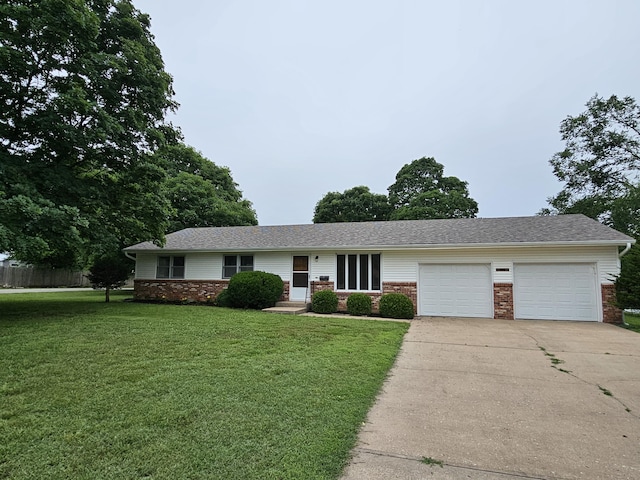 1313 S Madison Ave, Aurora, MO 65605 - ranch-style house featuring a garage, driveway, brick siding, and a front yard