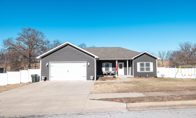 single story home featuring a garage, a front lawn, and covered porch