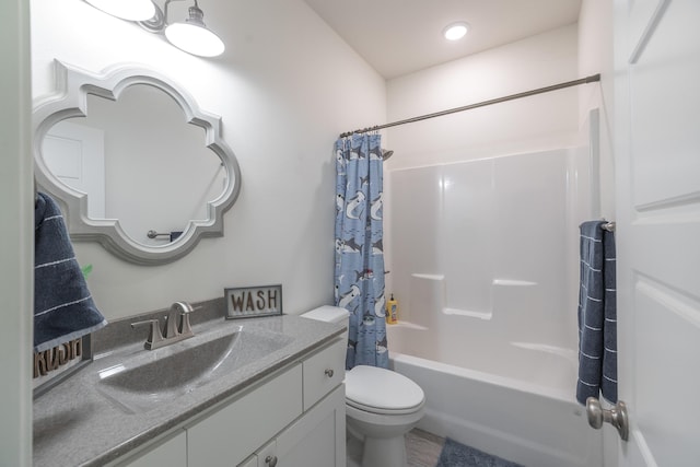 full bathroom with vanity, shower / bathtub combination with curtain, and toilet