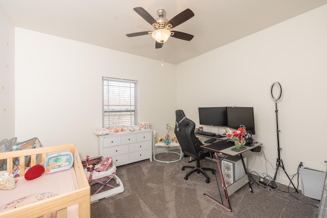 carpeted office space featuring ceiling fan