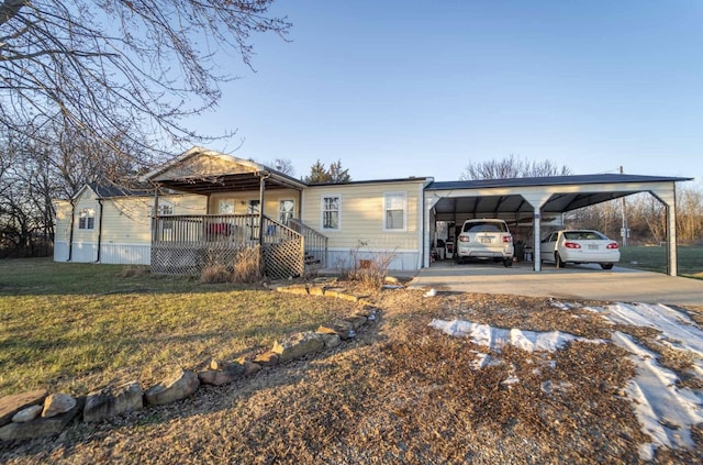 view of front facade with a front yard, a carport, and a porch