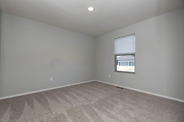 unfurnished room with carpet floors