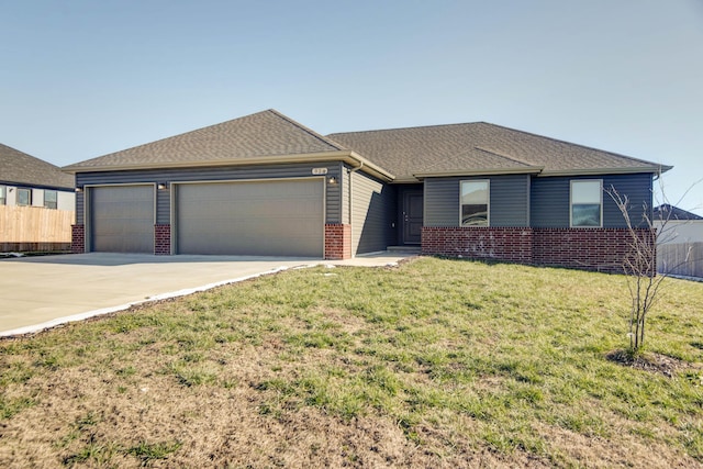 single story home featuring a garage and a front lawn