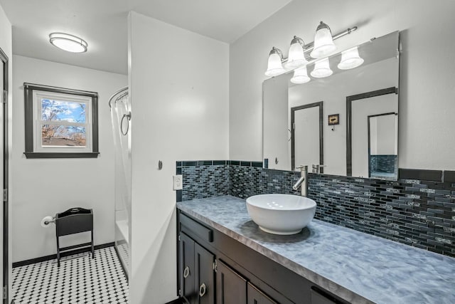 bathroom featuring vanity, bathing tub / shower combination, and decorative backsplash