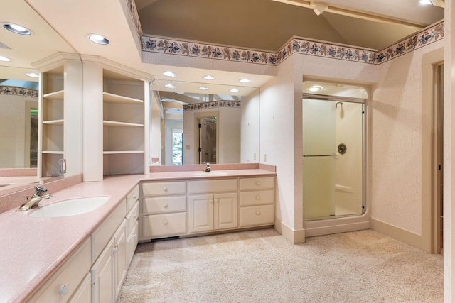 bathroom with an enclosed shower, vanity, and lofted ceiling