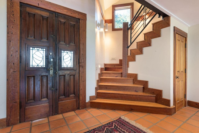 entrance foyer featuring tile patterned flooring