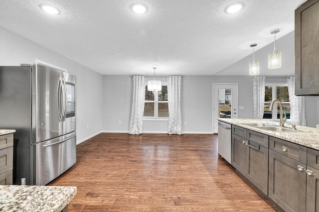 1989 Crawford St, West Plains, MO 65775 - kitchen with light stone countertops, appliances with stainless steel finishes, sink, and pendant lighting